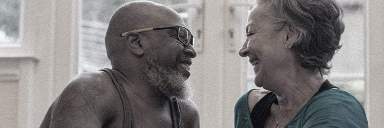 Man and women smile at each other